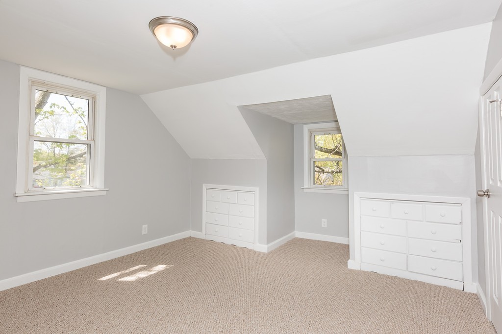 219 Cooper Street Springfield, MA 01108 - Photo 22 of 29 an empty room with windows and closet