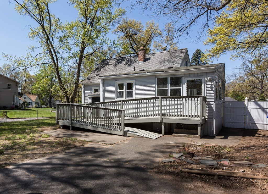 219 Cooper Street Springfield, MA 01108 - Photo 27 of 29 a view of a house with a deck and a yard