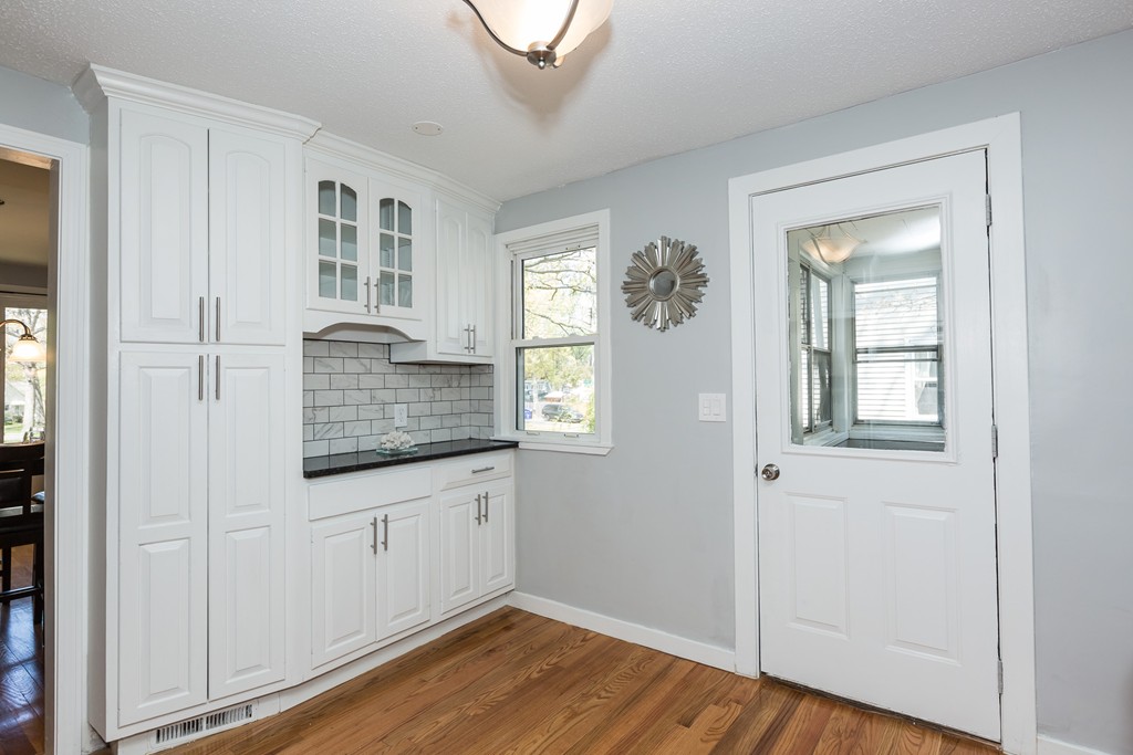 219 Cooper Street Springfield, MA 01108 - Photo 4 of 29 a room with white cabinets and window