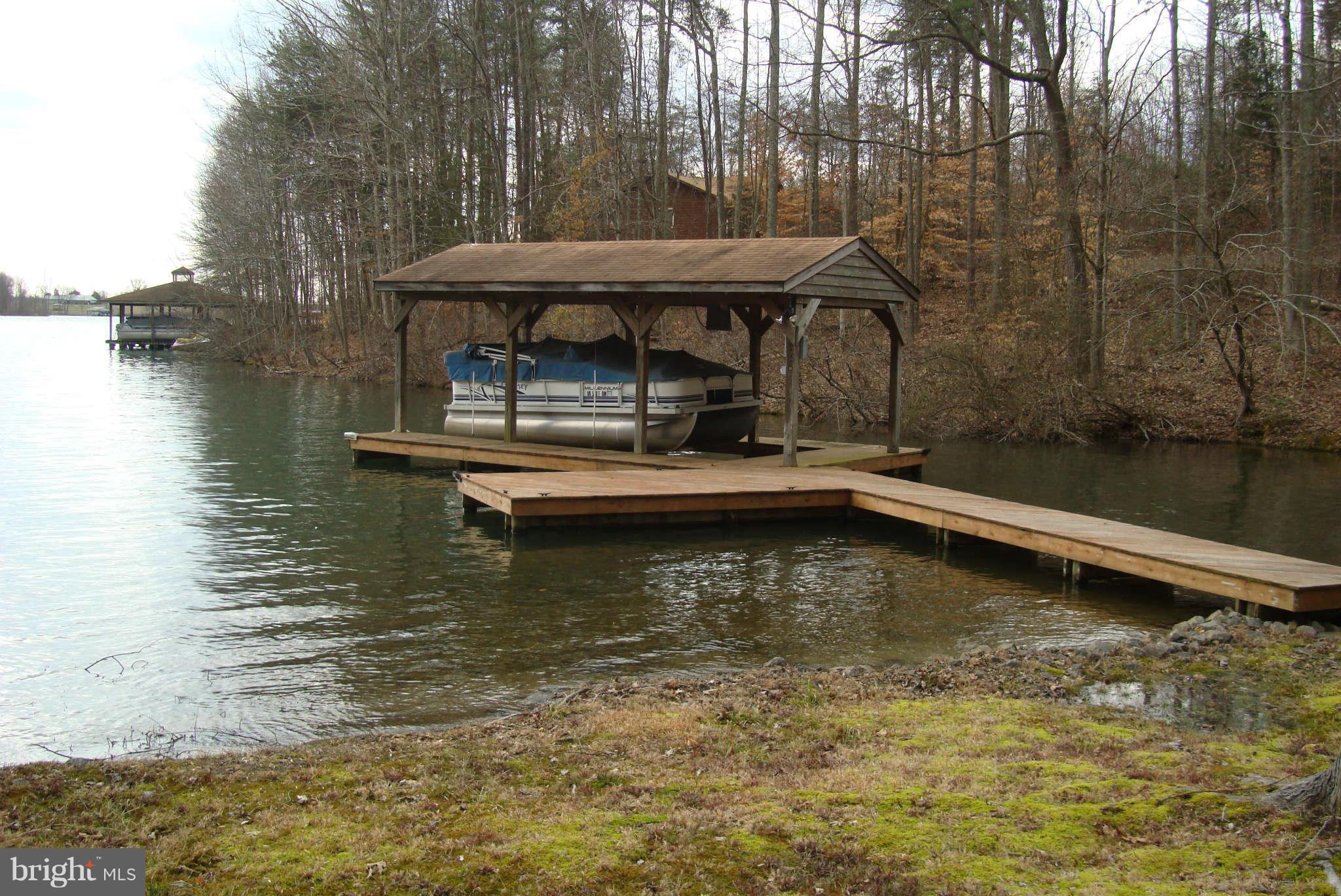 2 Wallers Quarters Road Bumpass, VA 23024 - Photo 11 of 13 a view of a swimming pool with a bench