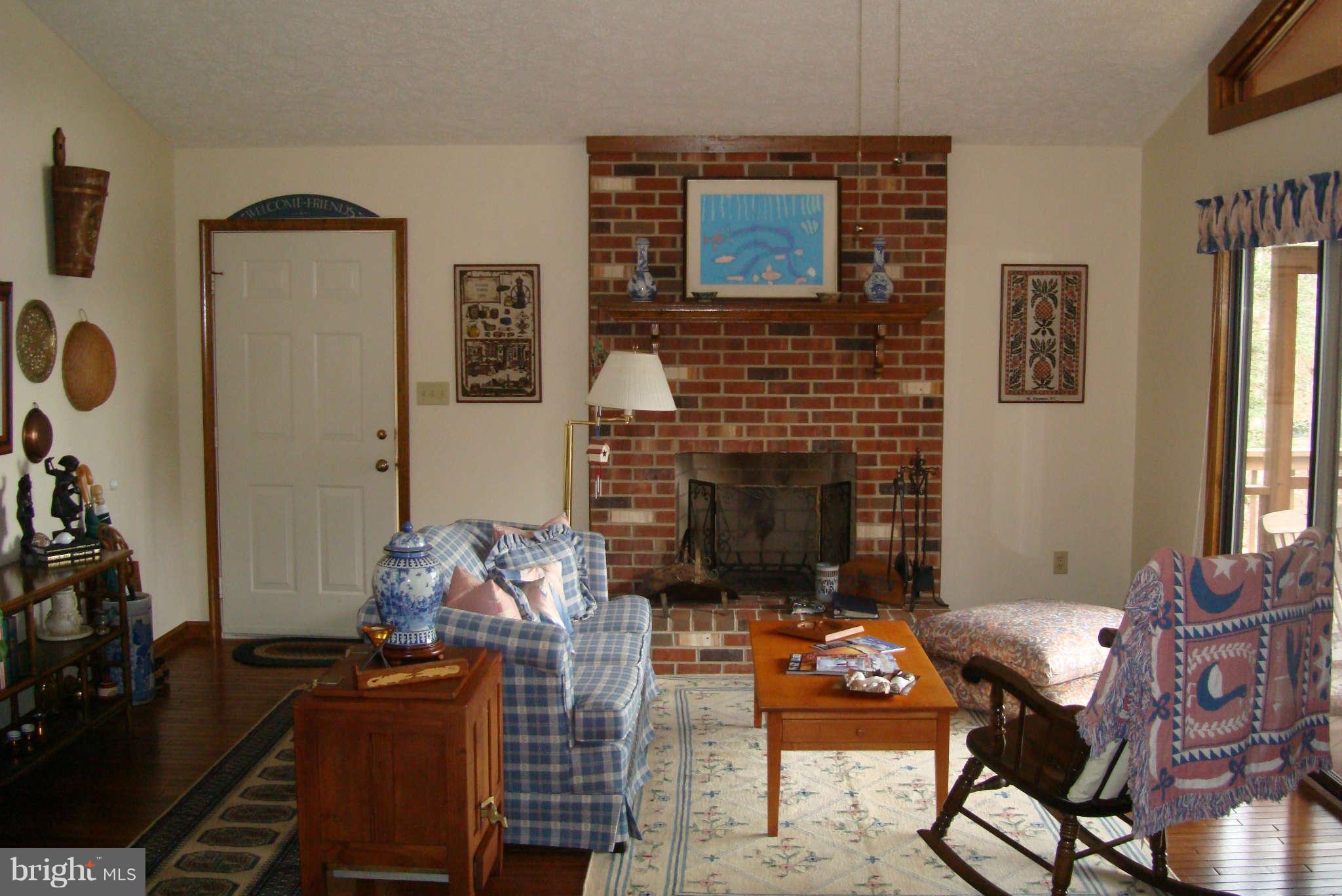 2 Wallers Quarters Road Bumpass, VA 23024 - Photo 7 of 13 a living room with furniture and a fireplace