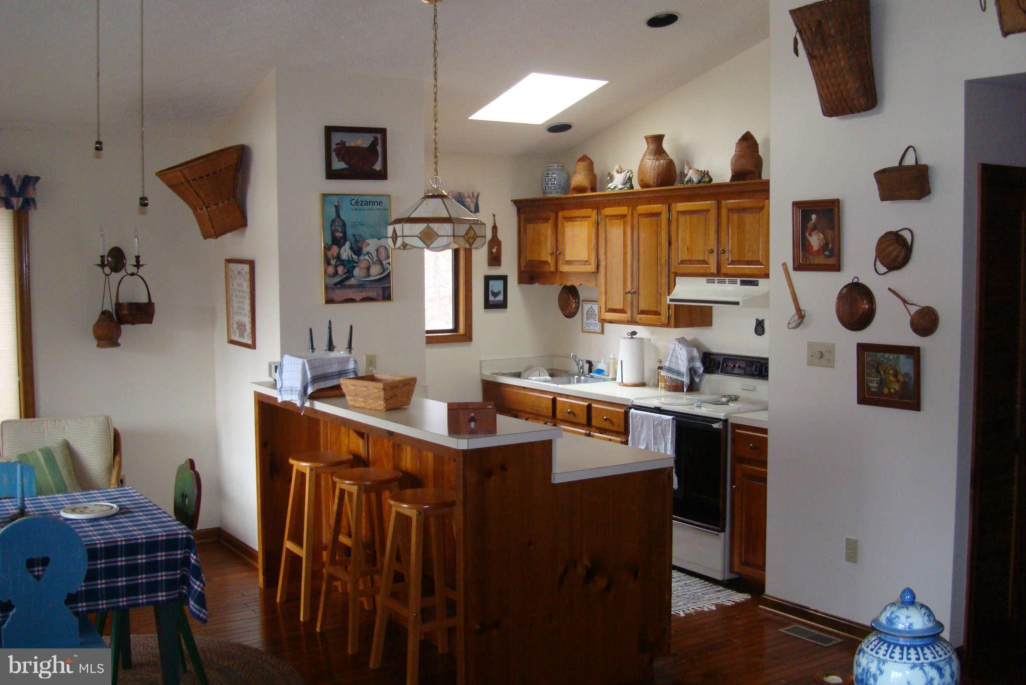 2 Wallers Quarters Road Bumpass, VA 23024 - Photo 8 of 13 a kitchen with stainless steel appliances granite countertop a sink a stove and a refrigerator