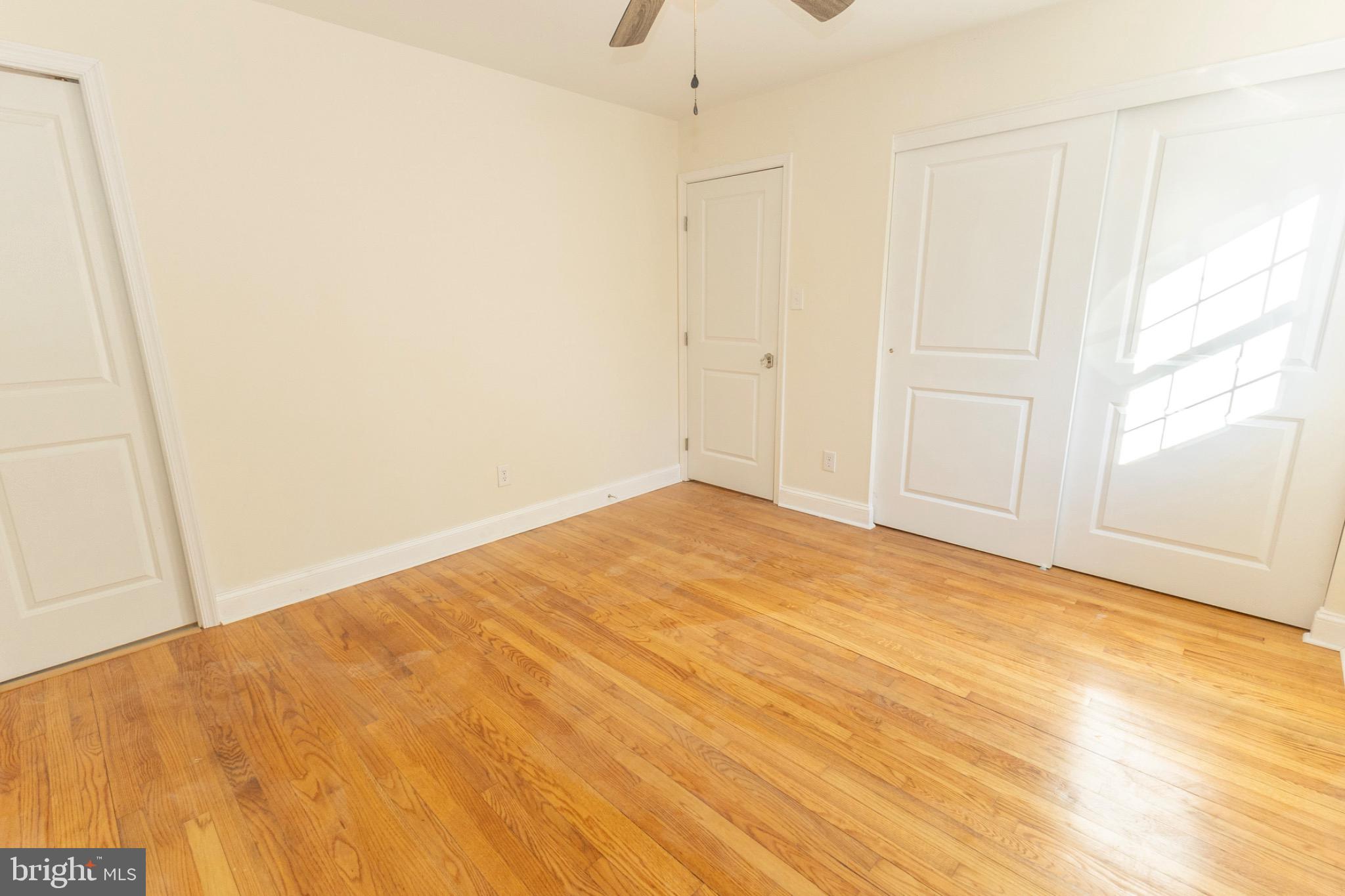 49151 Wynne Road Ridge, MD 20680 - Photo 46 of 80 Bright and airy bedroom with warm wood floors.
