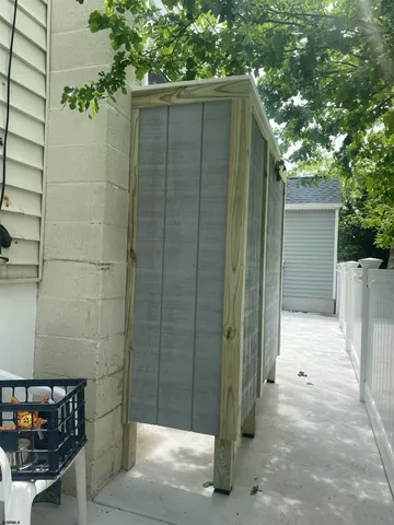 a bathroom with a shower and a sink