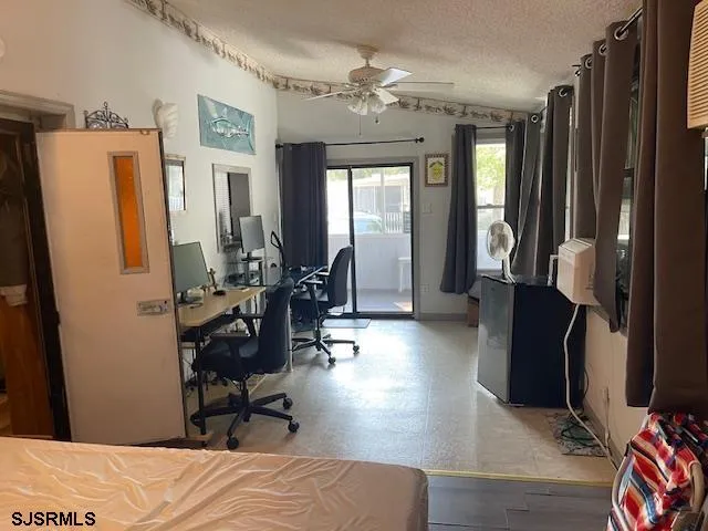 a bedroom with furniture and a window