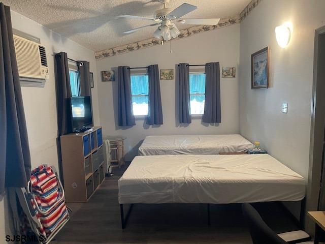 81 Flounder Ocean View, NJ 08230 - Photo 10 of 25 a bedroom with a bed and a chandelier