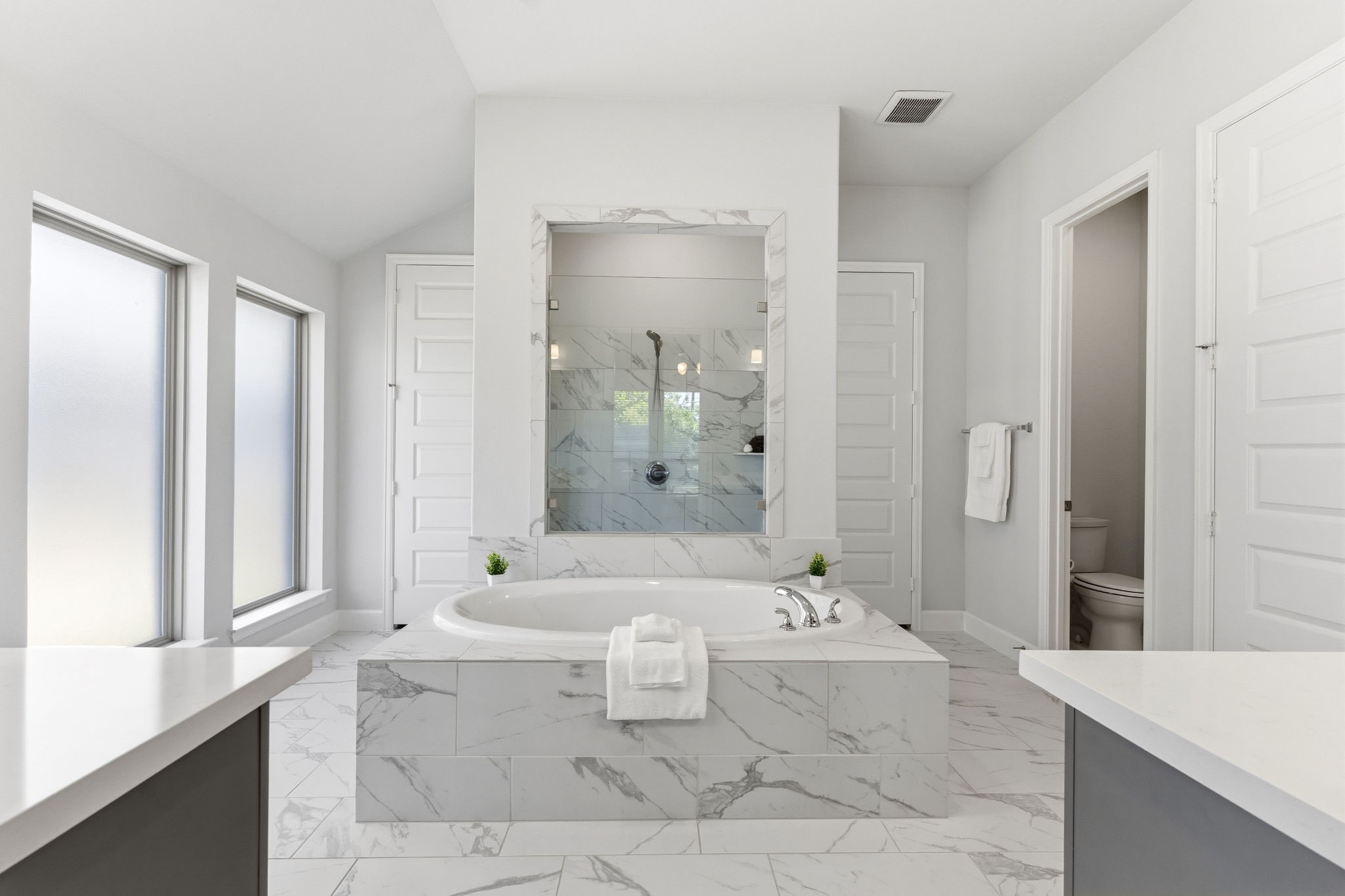 15618 Turtlehead Trail Conroe, TX 77302 - Photo 6 of 50 Primary Ensuite Bathroom w/ Gorgeously Appointed Soaking Tub, Massive Tiled and Glass Mud Set Shower and Dual Closets and Vanities! Come Relax!