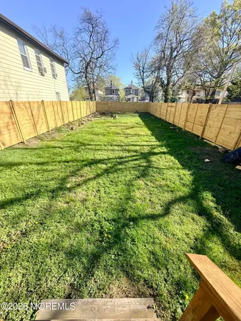 a view of yard with swimming pool