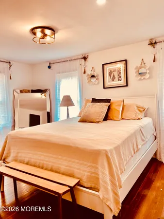 a bedroom with a bed and a lamp