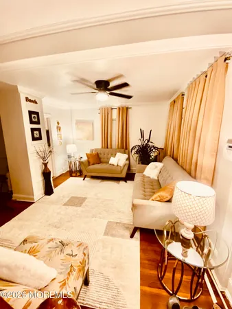 a bedroom with a bed and ceiling fan