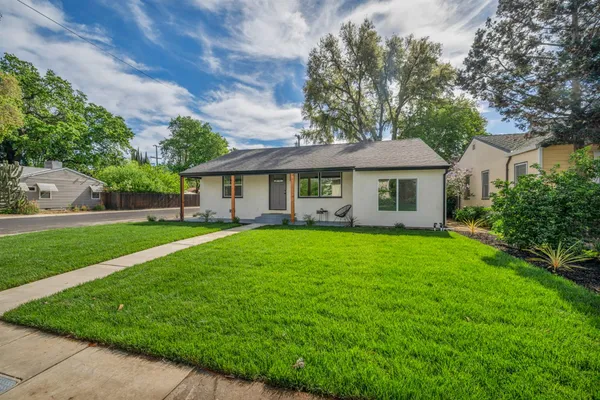 a house with trees in the background