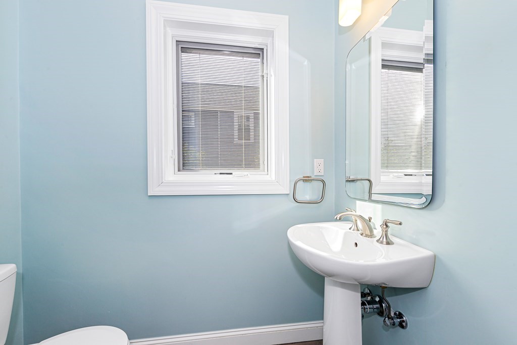 31 Knoll Street Boston, MA 02131 - Photo 15 of 34 a bathroom with a sink a toilet and a mirror