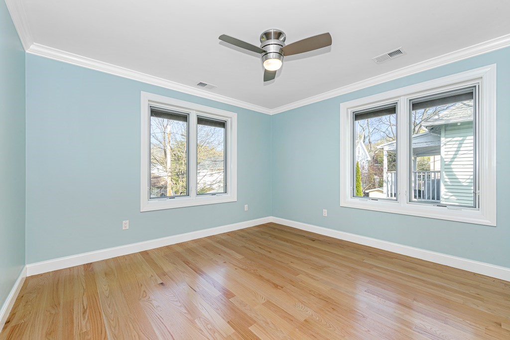 31 Knoll Street Boston, MA 02131 - Photo 28 of 34 a view of an empty room with wooden floor and a window