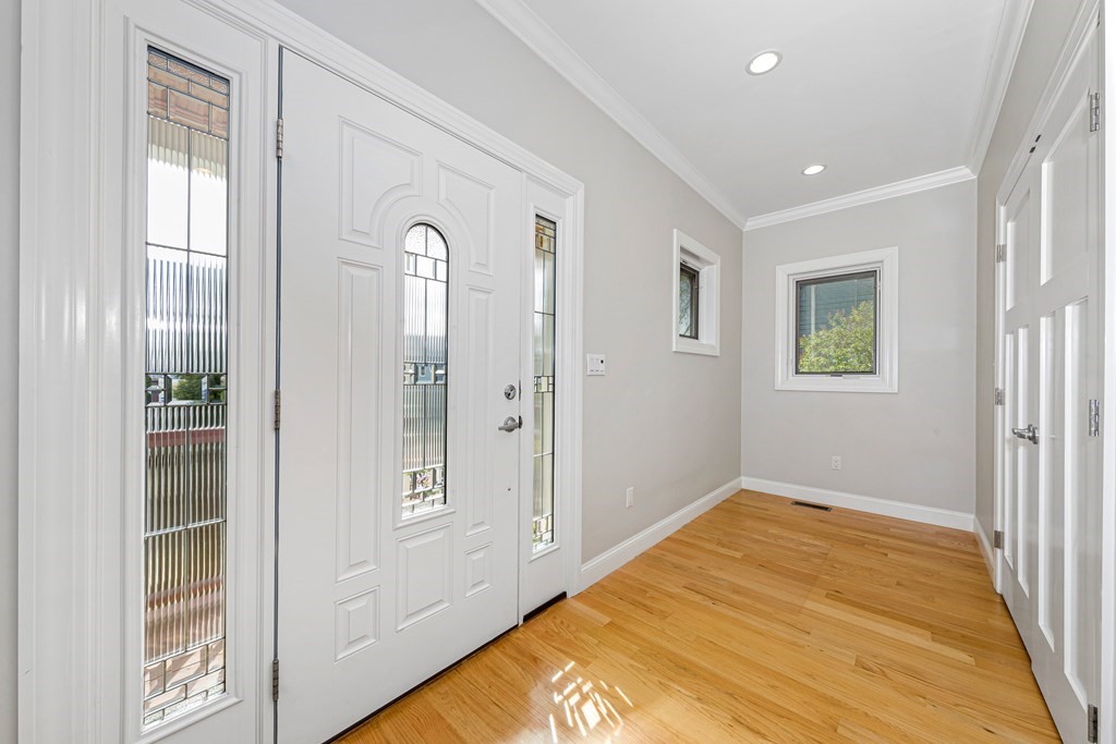 31 Knoll Street Boston, MA 02131 - Photo 5 of 34 a view of empty room with wooden floor