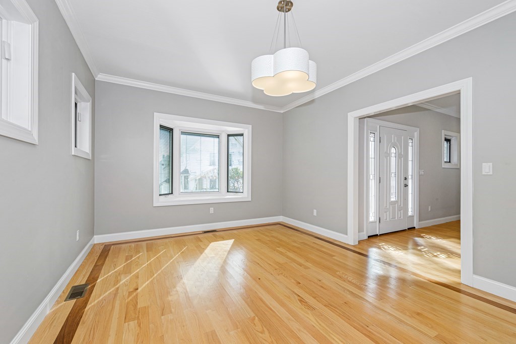 31 Knoll Street Boston, MA 02131 - Photo 7 of 34 a view of empty room with wooden floor