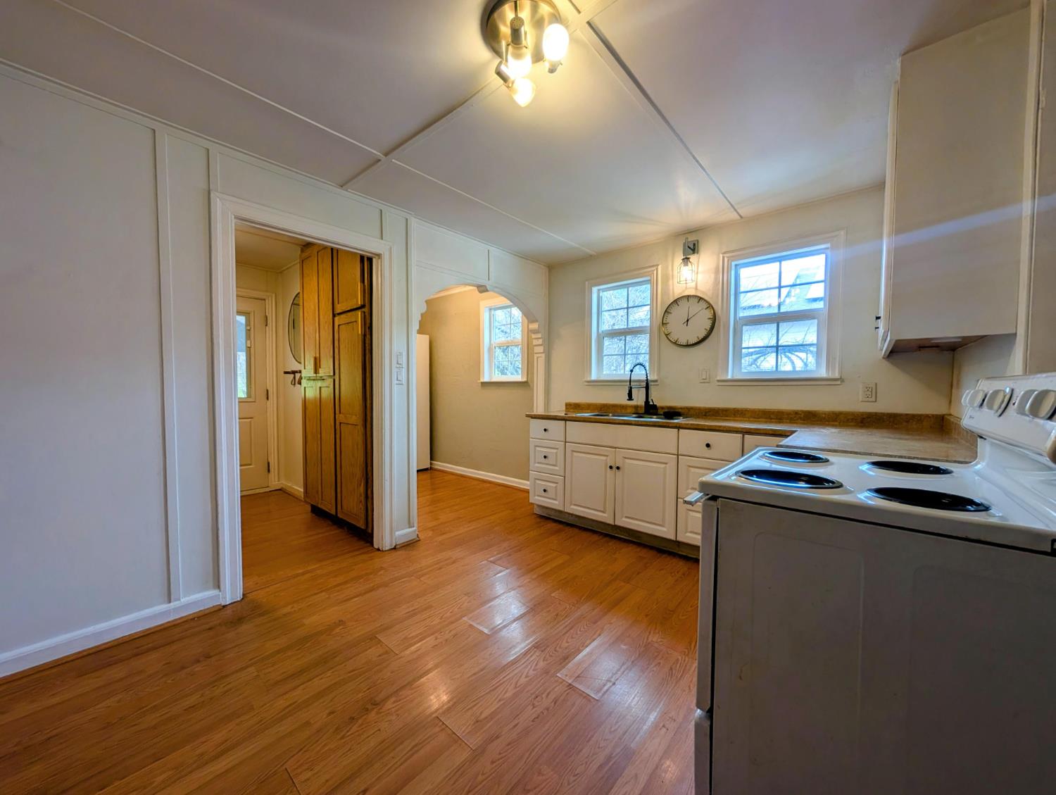 203 Market Street San Andreas, CA 95249 - Photo 15 of 54 a kitchen with granite countertop a sink cabinets and wooden floor