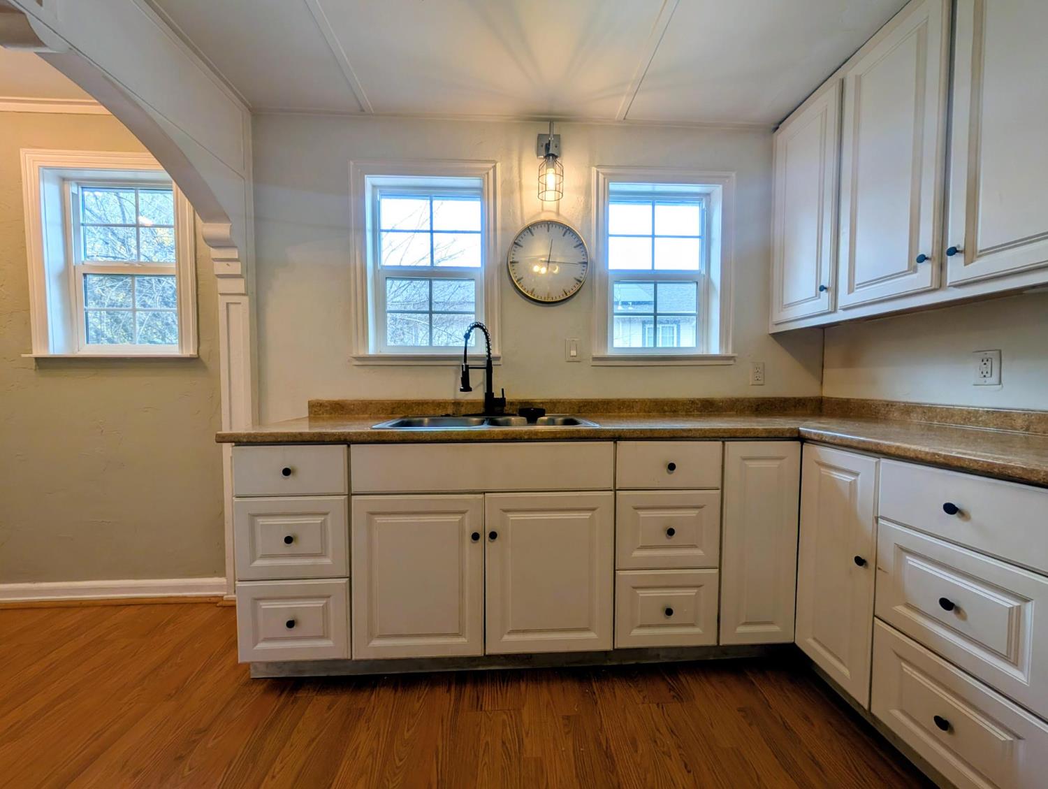 203 Market Street San Andreas, CA 95249 - Photo 16 of 54 a kitchen with granite countertop white cabinets and a large window