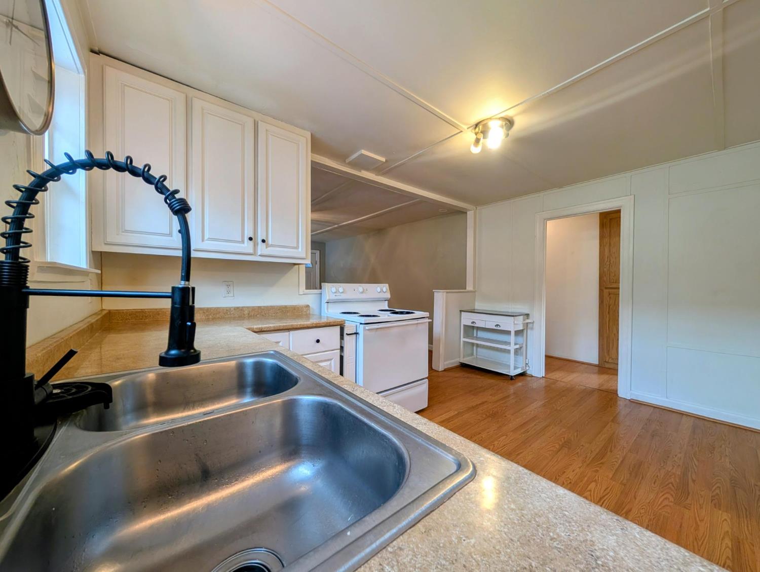 203 Market Street San Andreas, CA 95249 - Photo 19 of 54 a kitchen with stainless steel appliances granite countertop a sink and a stove