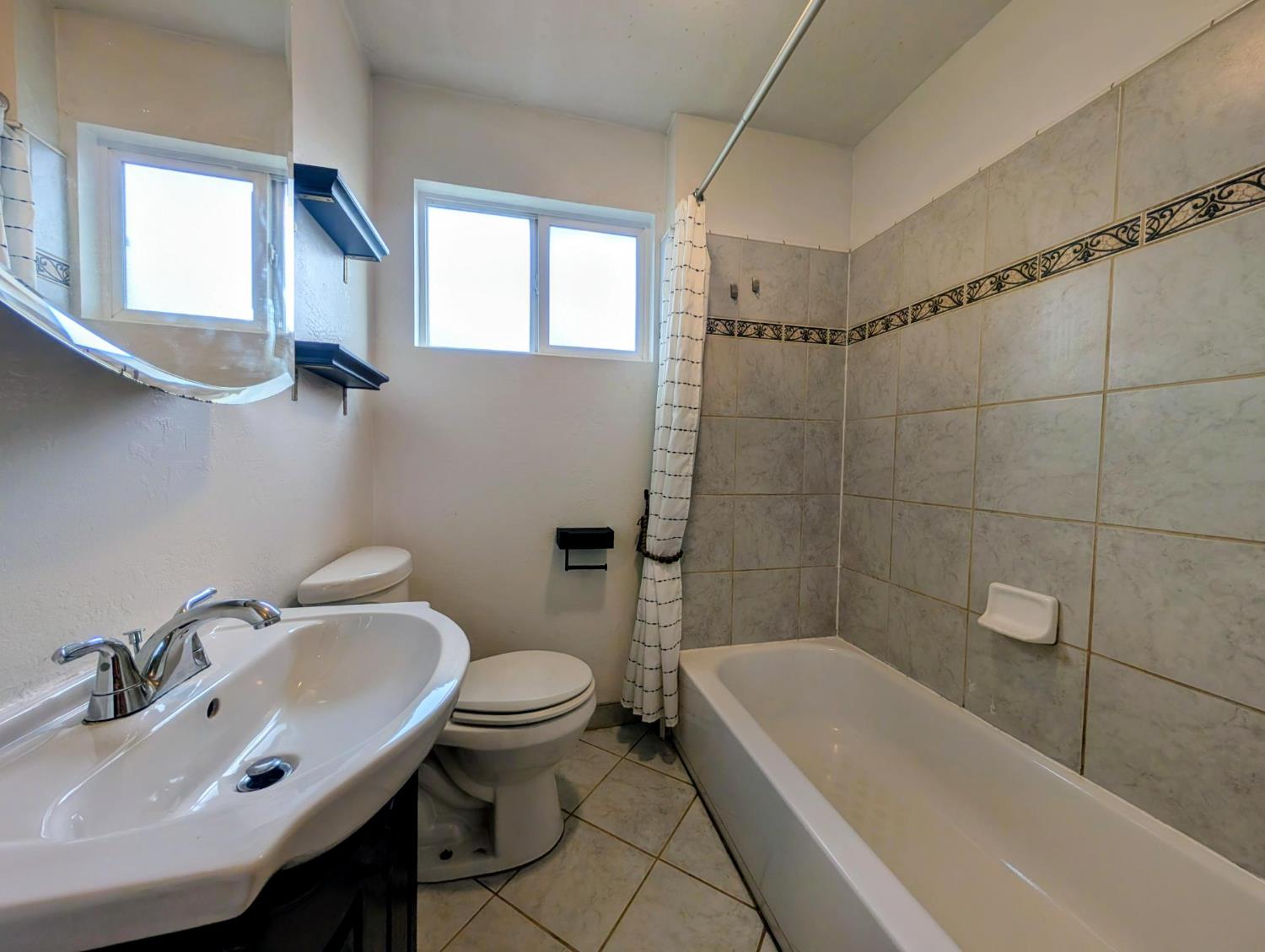 203 Market Street San Andreas, CA 95249 - Photo 26 of 54 a bathroom with a sink toilet and bathtub