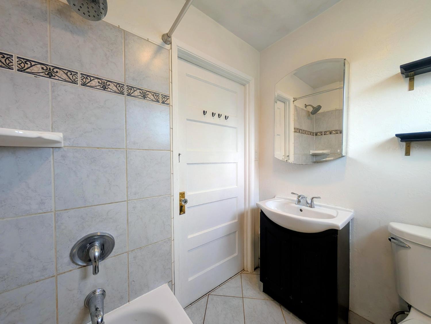 203 Market Street San Andreas, CA 95249 - Photo 27 of 54 a bathroom with a sink a toilet and shower