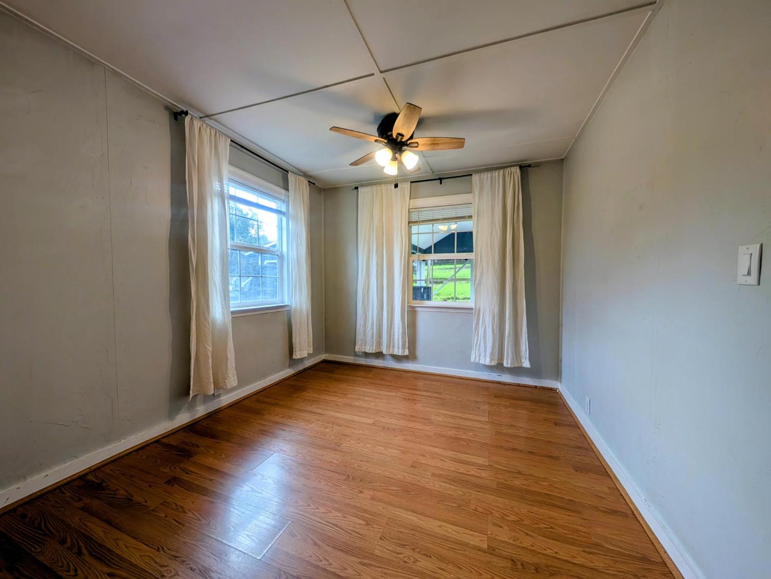203 Market Street San Andreas, CA 95249 - Photo 29 of 54 a view of empty room with wooden floor and fan