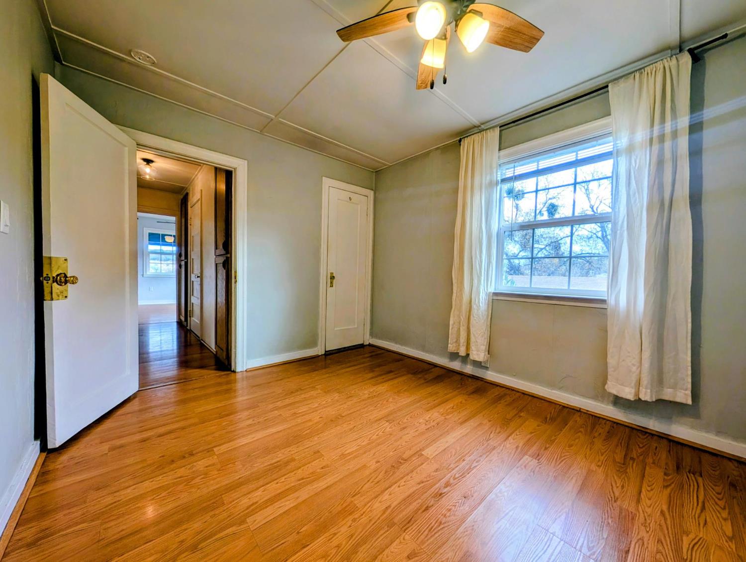 203 Market Street San Andreas, CA 95249 - Photo 30 of 54 an empty room with wooden floor and windows