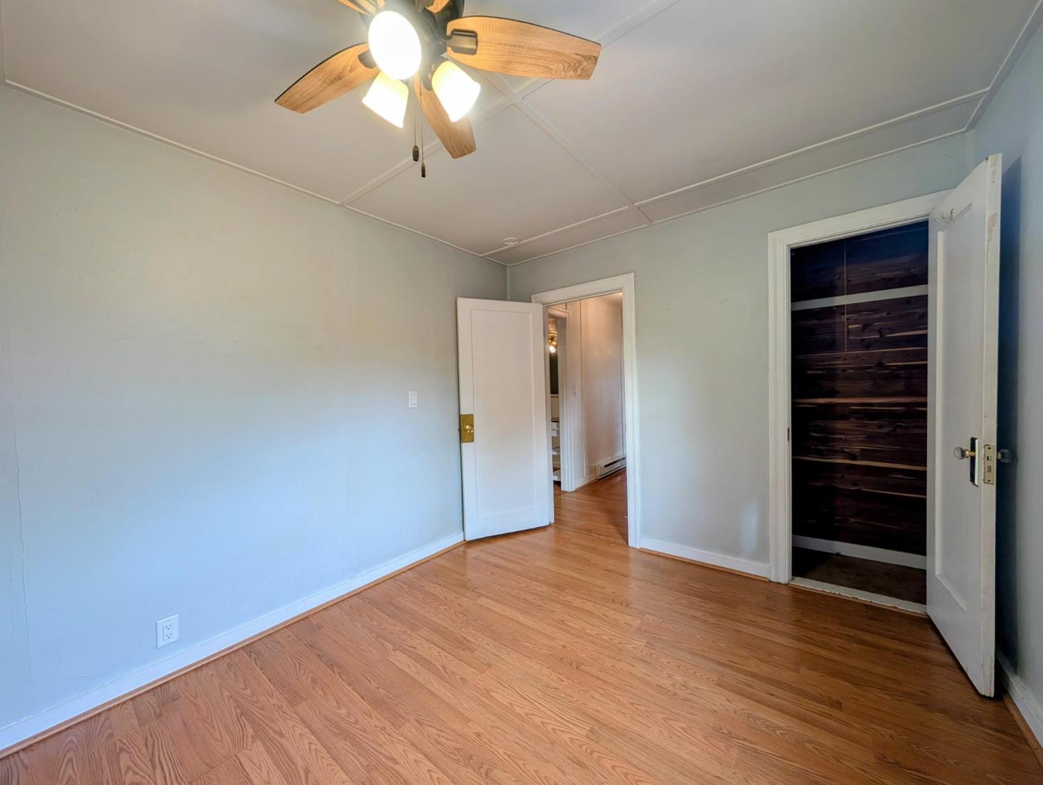 203 Market Street San Andreas, CA 95249 - Photo 31 of 54 a view of empty room with wooden floor and fan