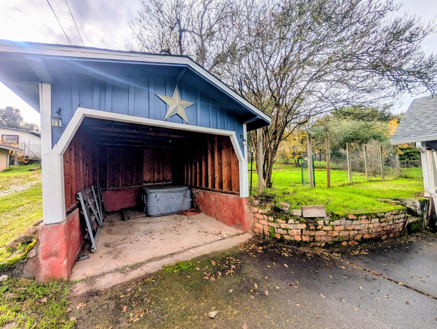 203 Market Street San Andreas, CA 95249 - Photo 34 of 54 a view of a house with a yard chairs and a garage