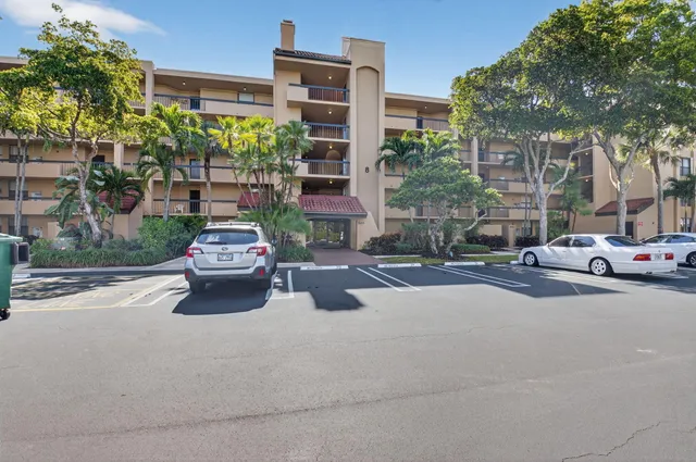 a view of a street with cars on road