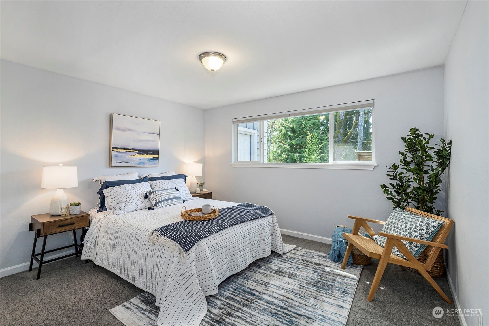 3741 Northeast Lincoln Road Poulsbo, WA 98370 - Photo 18 of 35 a bedroom with a bed and a window