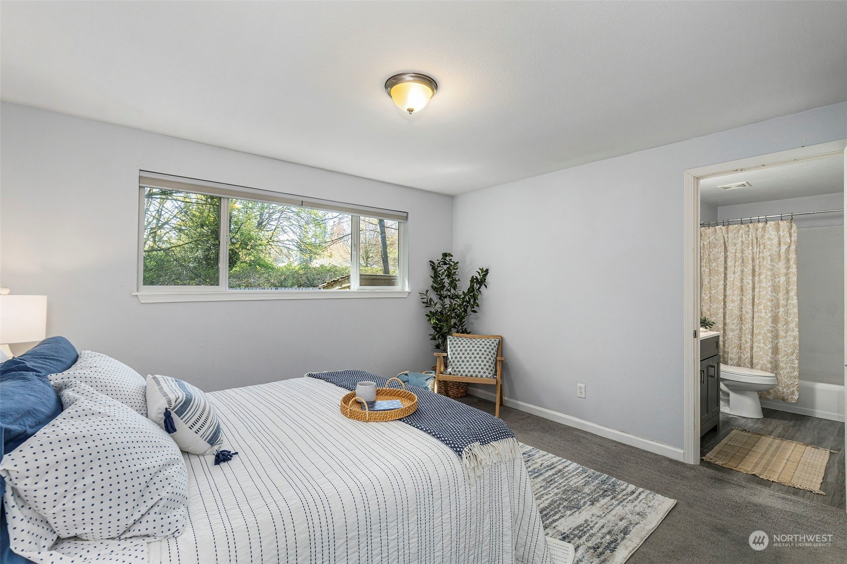 3741 Northeast Lincoln Road Poulsbo, WA 98370 - Photo 19 of 35 a bedroom with a bed and a window