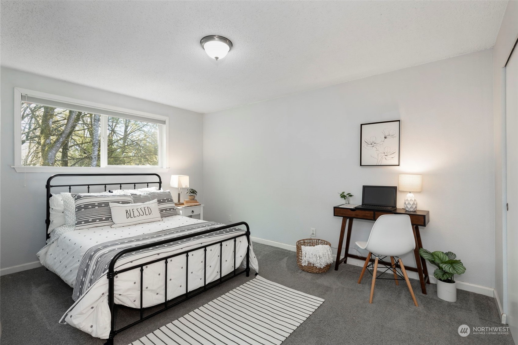 3741 Northeast Lincoln Road Poulsbo, WA 98370 - Photo 21 of 35 a bedroom with a bed and a window