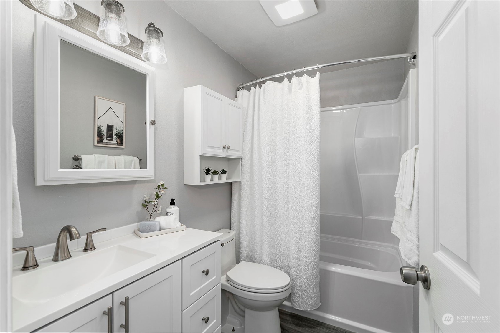 3741 Northeast Lincoln Road Poulsbo, WA 98370 - Photo 23 of 35 a bathroom with a sink toilet and shower