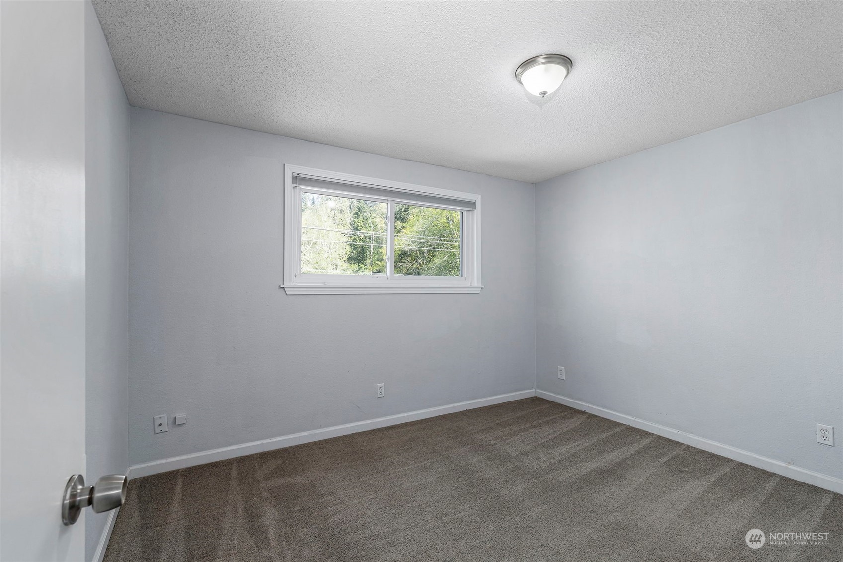 3741 Northeast Lincoln Road Poulsbo, WA 98370 - Photo 25 of 35 an empty room with windows