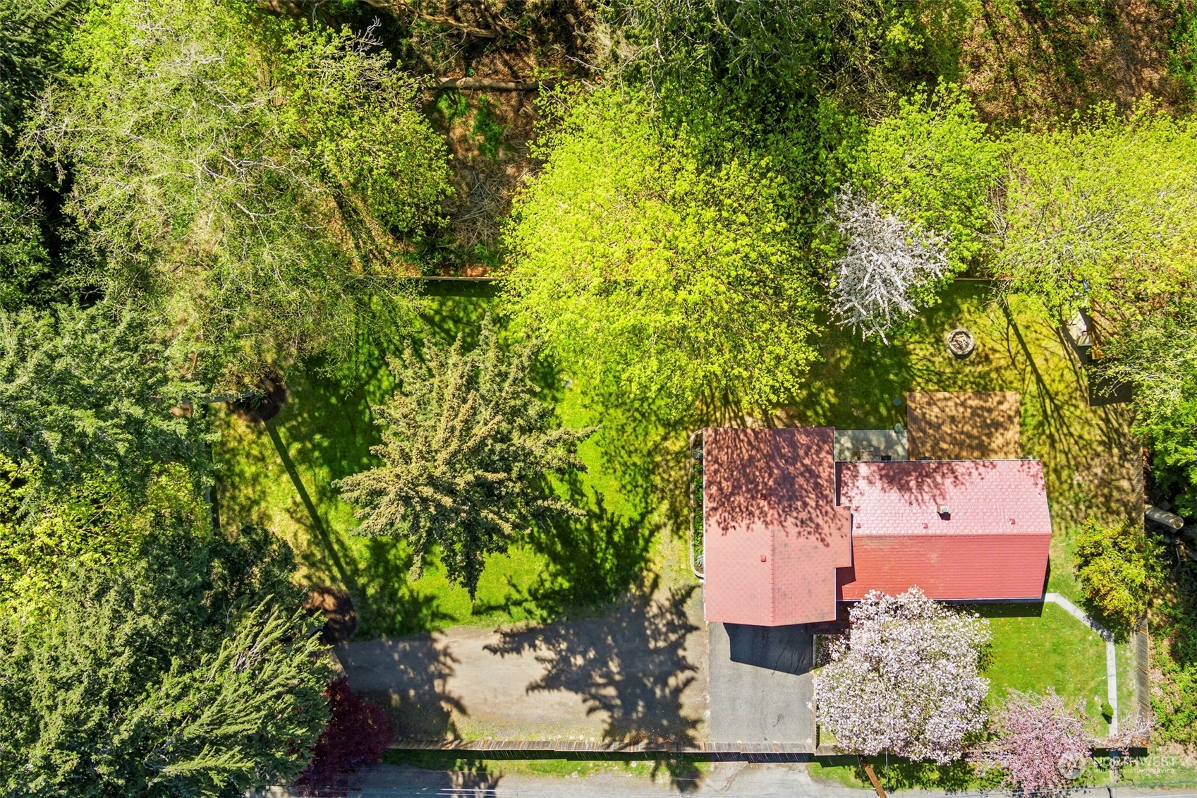 3741 Northeast Lincoln Road Poulsbo, WA 98370 - Photo 34 of 35 an aerial view of a house with a yard basket ball court and outdoor seating