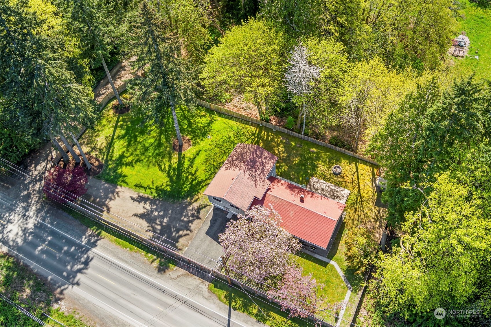 3741 Northeast Lincoln Road Poulsbo, WA 98370 - Photo 35 of 35 a view of a yard with a tree