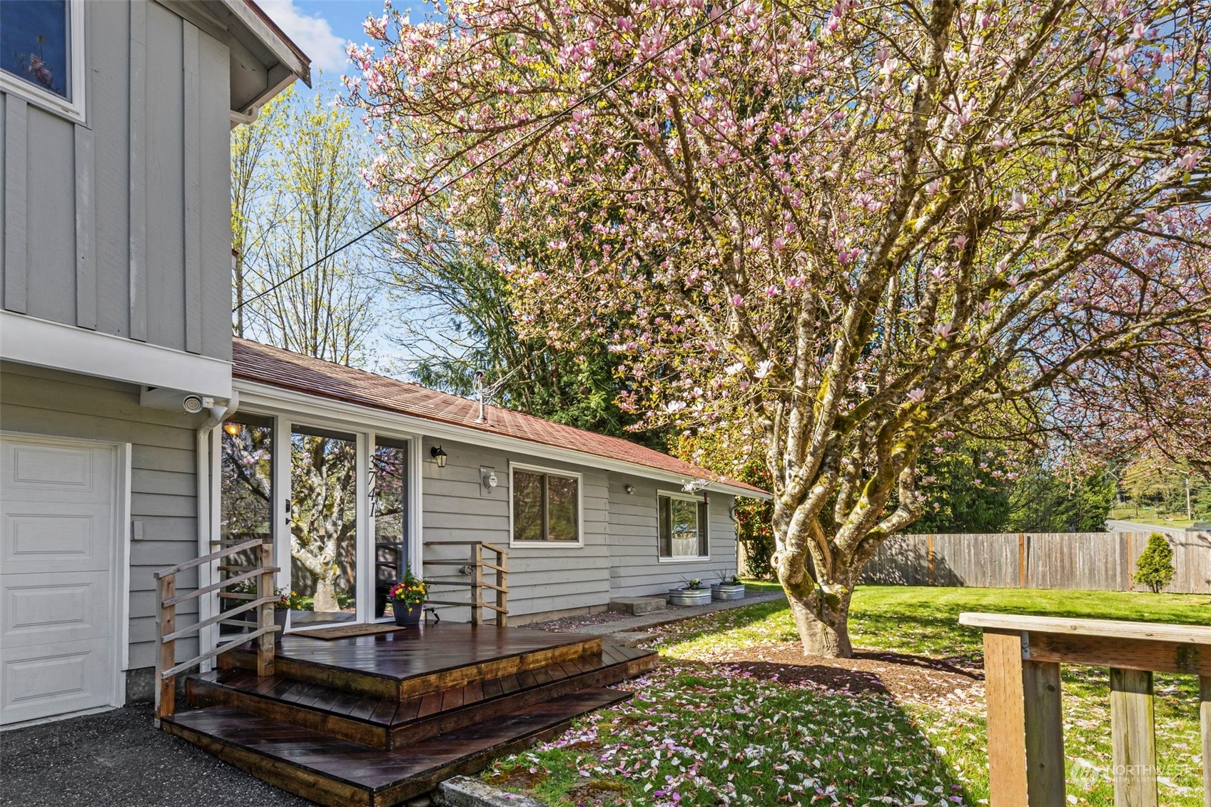 3741 Northeast Lincoln Road Poulsbo, WA 98370 - Photo 6 of 35 a backyard of a house with barbeque oven table and chairs