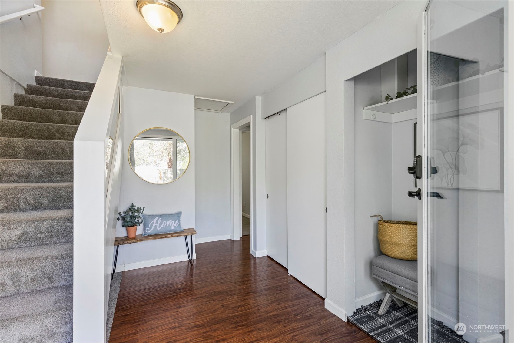 3741 Northeast Lincoln Road Poulsbo, WA 98370 - Photo 8 of 35 an empty room with wooden floor mirror and windows
