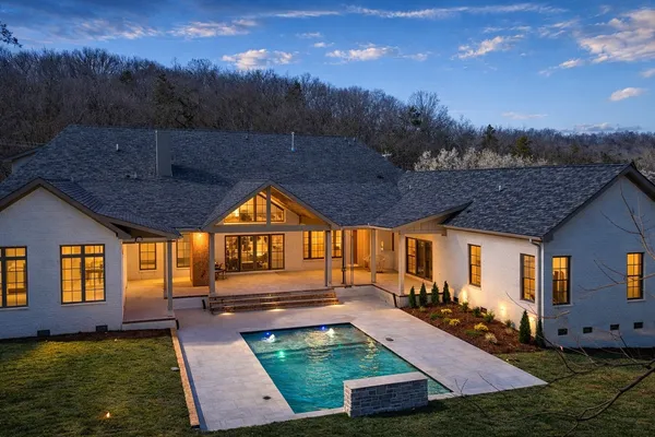a front view of house with yard and entertaining space