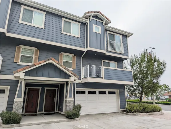 a front view of a house with garage