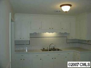 421 Nance Road Stanfield, NC 28163 - Photo 4 of 8 a kitchen with a sink and cabinets