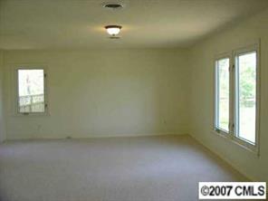 421 Nance Road Stanfield, NC 28163 - Photo 5 of 8 en empty room with a window