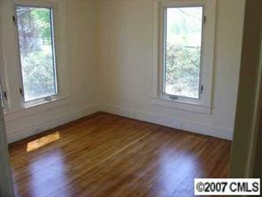 421 Nance Road Stanfield, NC 28163 - Photo 8 of 8 a view of an empty room and wooden floor