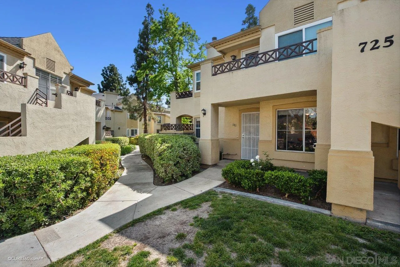 725 Brookstone Road Chula Vista, CA 91913 - Photo 3 of 30 a view of a house with brick walls and a yard with plants