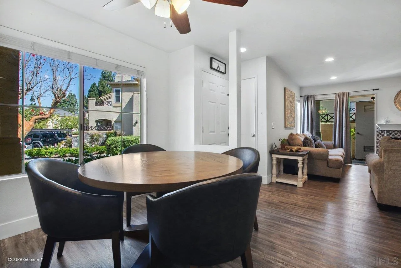 725 Brookstone Road Chula Vista, CA 91913 - Photo 7 of 30 a living room with furniture a wooden floor and a chandelier