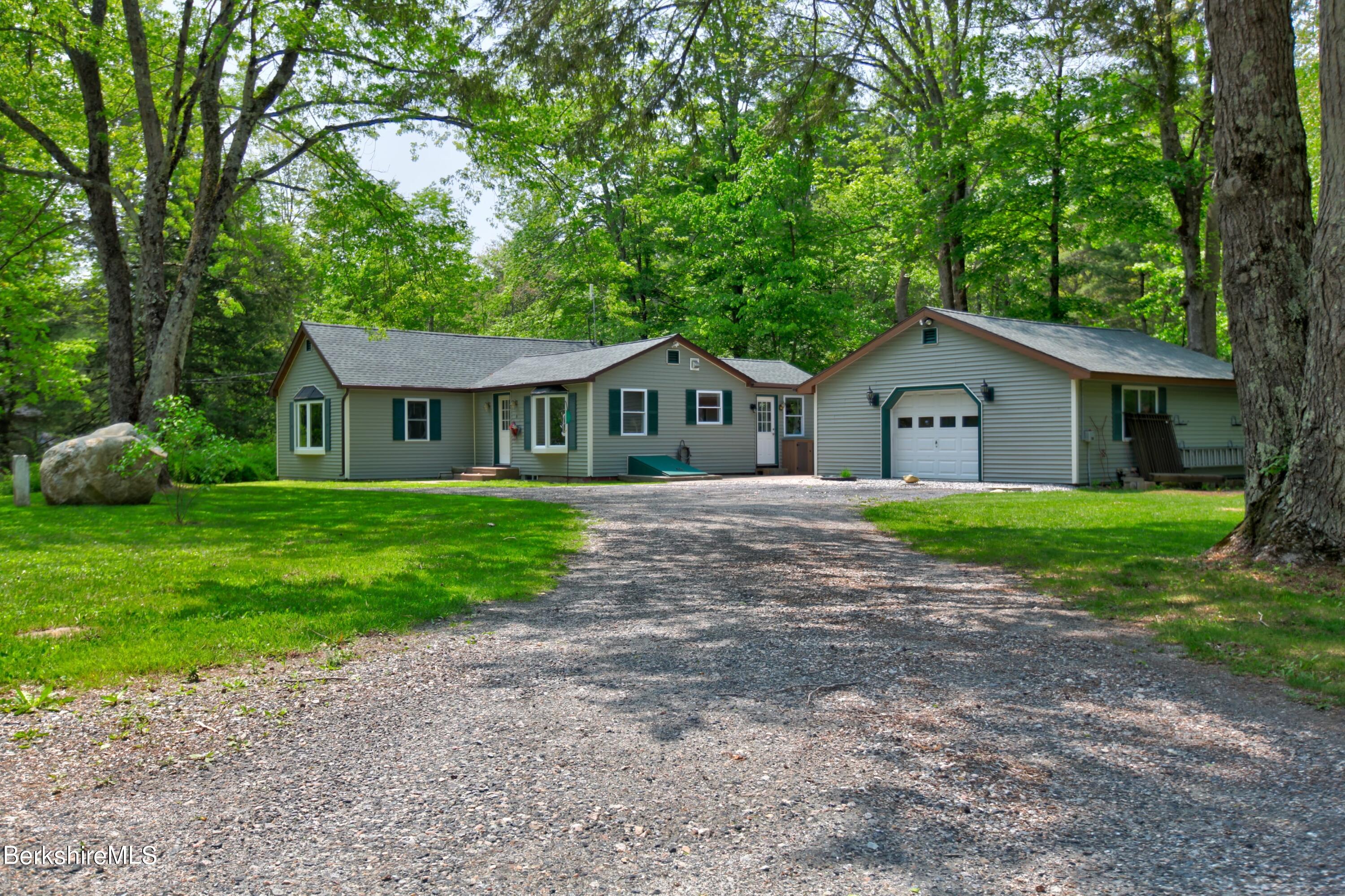 6 Roosterville Road Sandisfield, MA 01255 - Photo 1 of 35 a house with huge green field in front of it