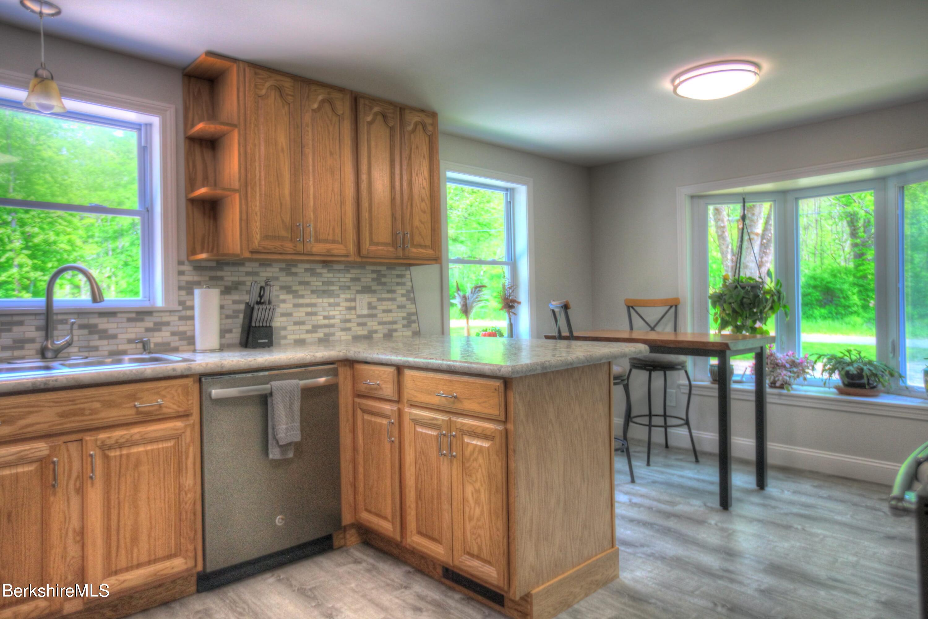 6 Roosterville Road Sandisfield, MA 01255 - Photo 12 of 35 a kitchen with a sink stove and cabinets