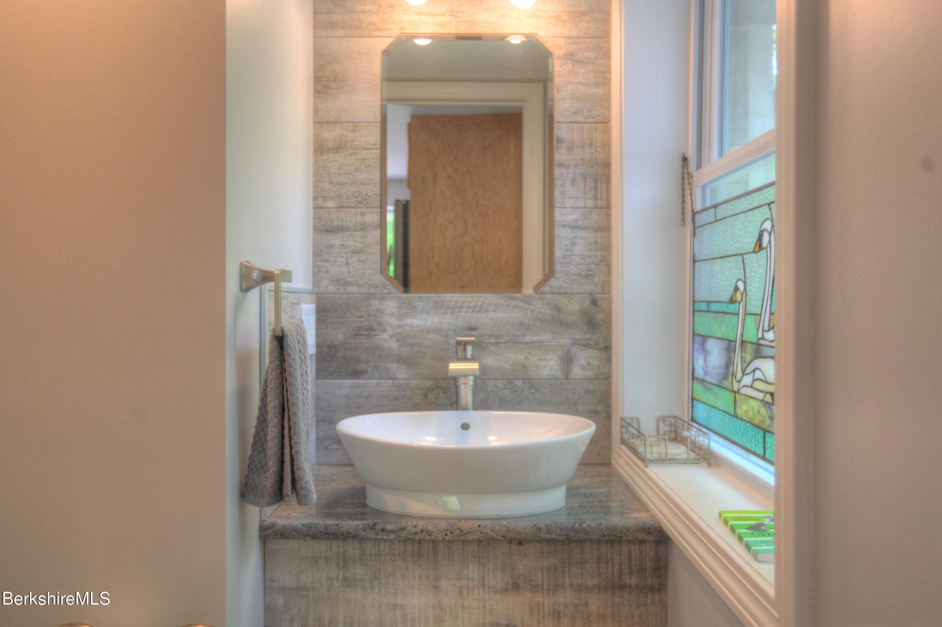 6 Roosterville Road Sandisfield, MA 01255 - Photo 13 of 35 a bathroom with a sink and a mirror