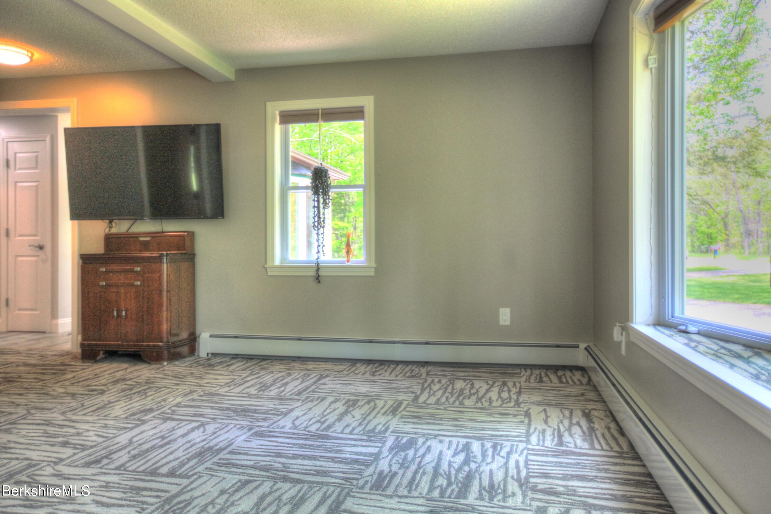 6 Roosterville Road Sandisfield, MA 01255 - Photo 16 of 35 a view of an empty room with a window