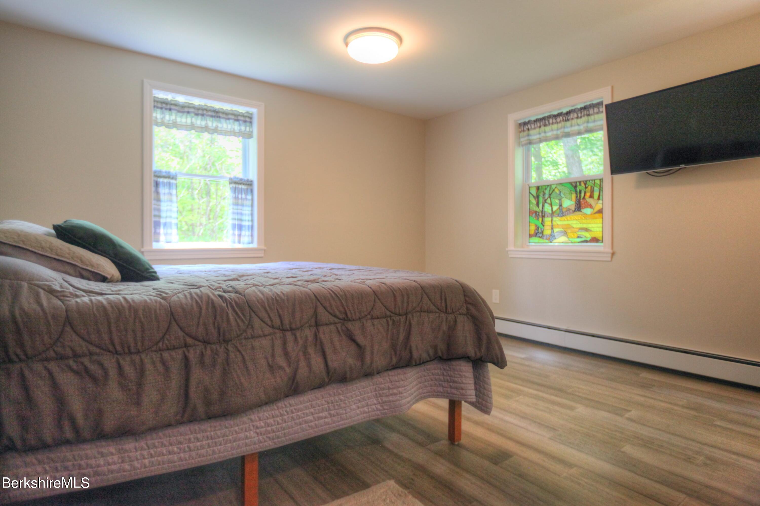 6 Roosterville Road Sandisfield, MA 01255 - Photo 17 of 35 a bedroom with a bed and a window